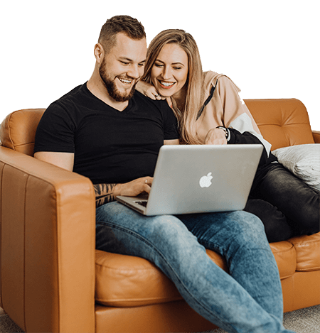 Couple on sofa looking at laptop video statistics representation